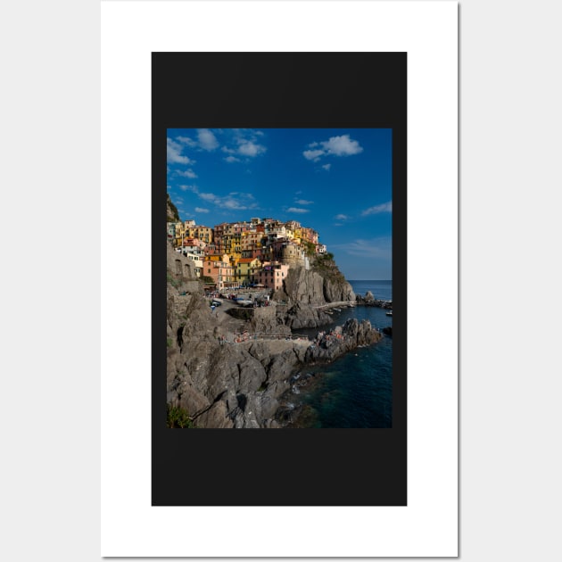 View on the cliff town of Manarola, one of the colorful Cinque Terre on the Italian west coast Wall Art by Dolfilms